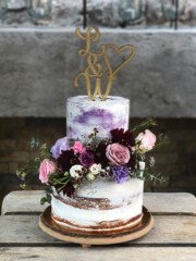 Dezzie Bakery Wedding Cake with Flowers Custom wedding cake designed by Dezzie Bakery in Calgary
